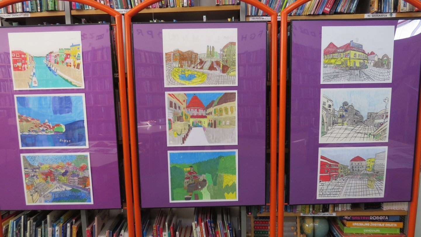 Na prvoj samostalnoj izložbi autističnog mladića koji ne govori riječima nego slikama Slike gradova 2 Postav radova Jakova Kneževića na samostalnoj izložbi u Knjižnici Dugave, 2025 / Snimio: Mladen Gerovac